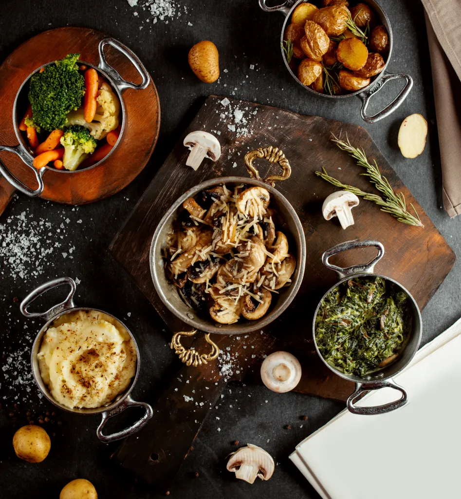 top-view-pans-with-mushroom-sautee-mashed-potato-sabzi-boiled-vegetables-roasted-potatoes